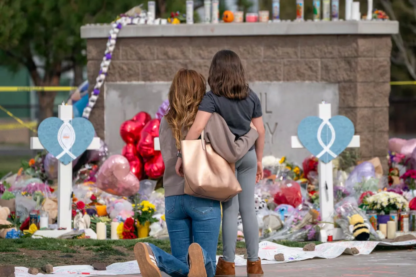 Mourning at the memorial at Silver Rail Elementary School