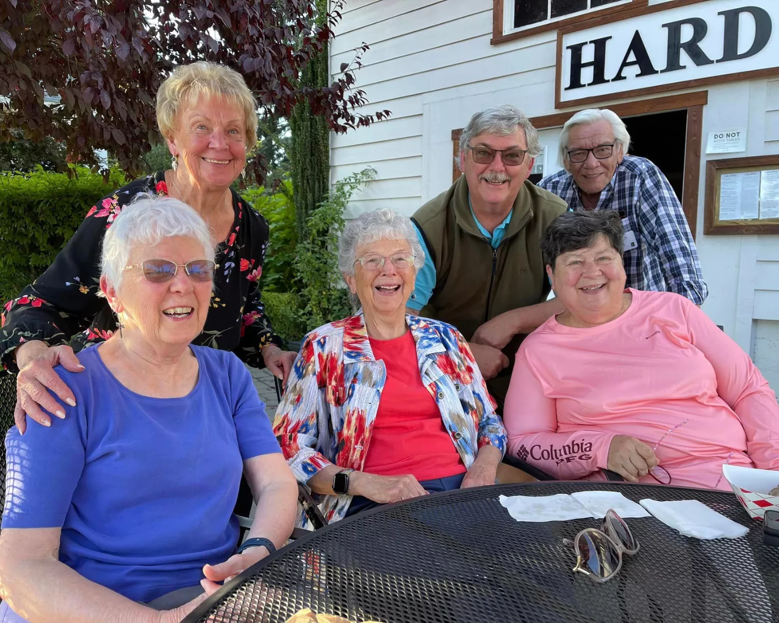 A group of OEA-Retired members smile and pose for a group picture at an event