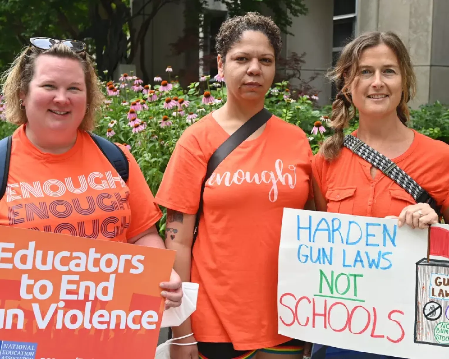 Educators with signs to end gun violence