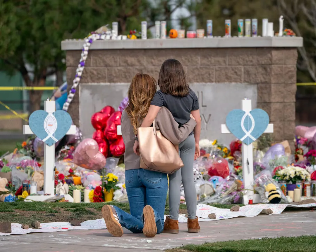 Mourning at the memorial at Silver Rail Elementary School