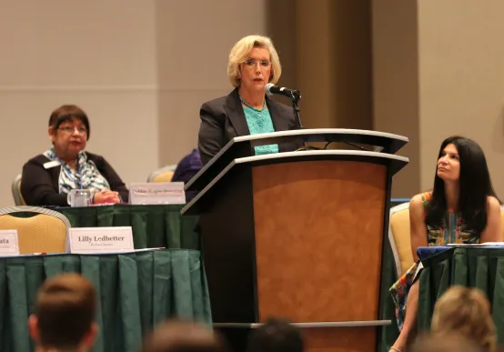Photo of Lilly Ledbetter speaking at dais