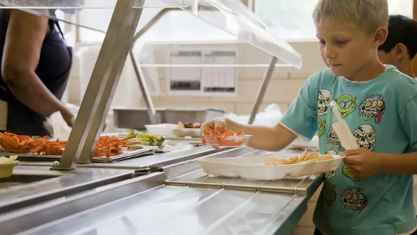 A student goes through a school lunch line