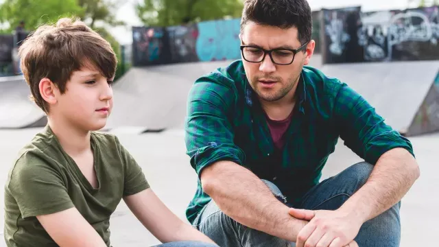 Father talking to son