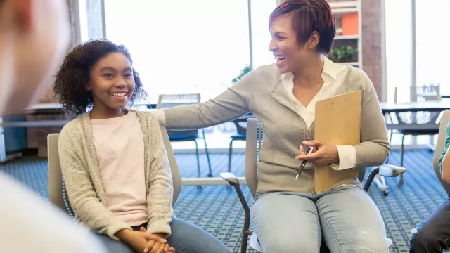 Student and educator in a classroom