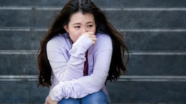 Teenager on steps after traumatic event