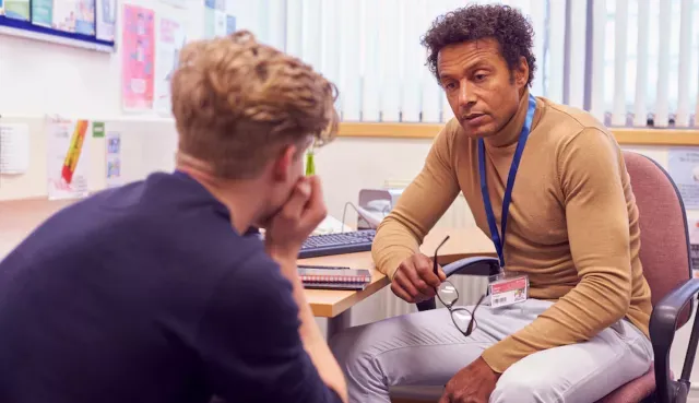 School counselor meets with teenage student