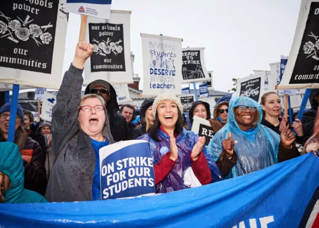 Educators cheer at a rally for Portland educators during their 15 day strike.